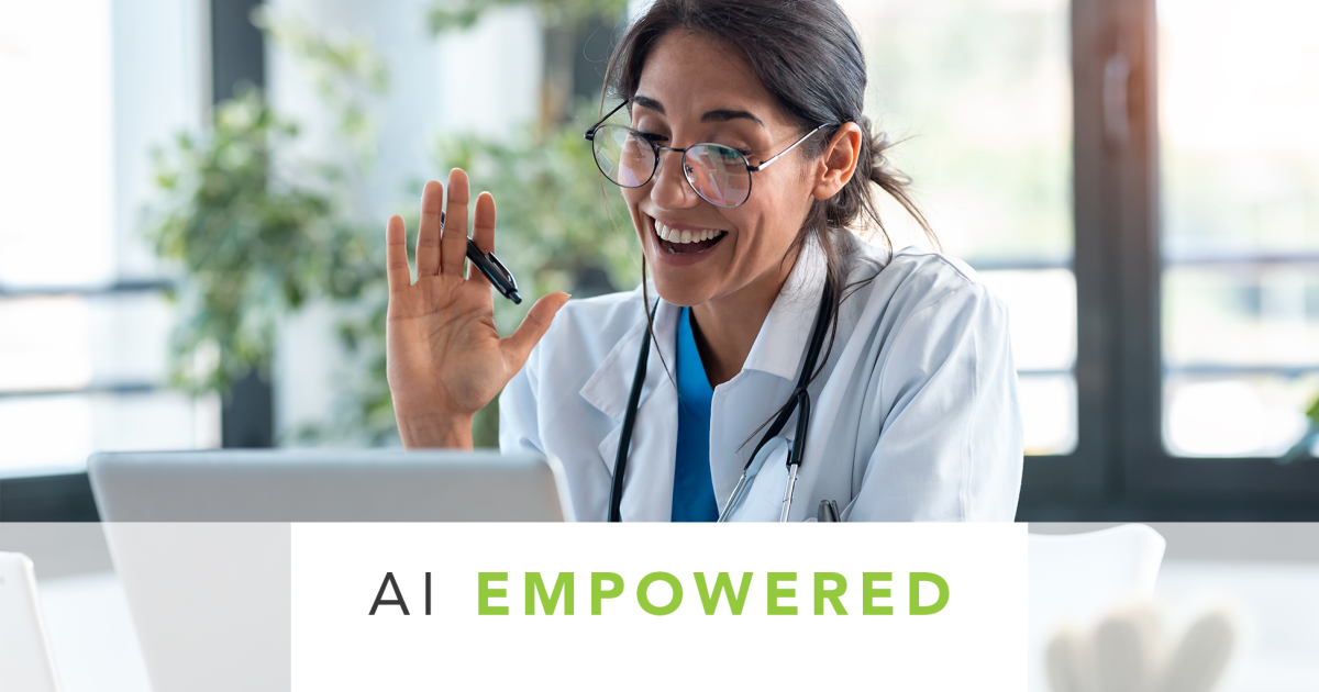 doctor at their desk waving to the screen as on a video conference