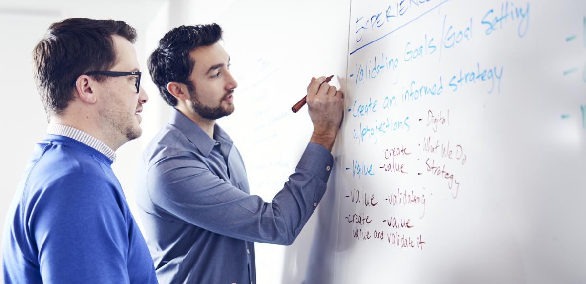 Fathomers at a white board in Mitchell