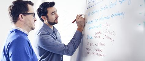 Fathomers at a white board in Mitchell