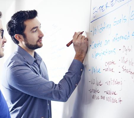 Fathomers at a white board in Mitchell